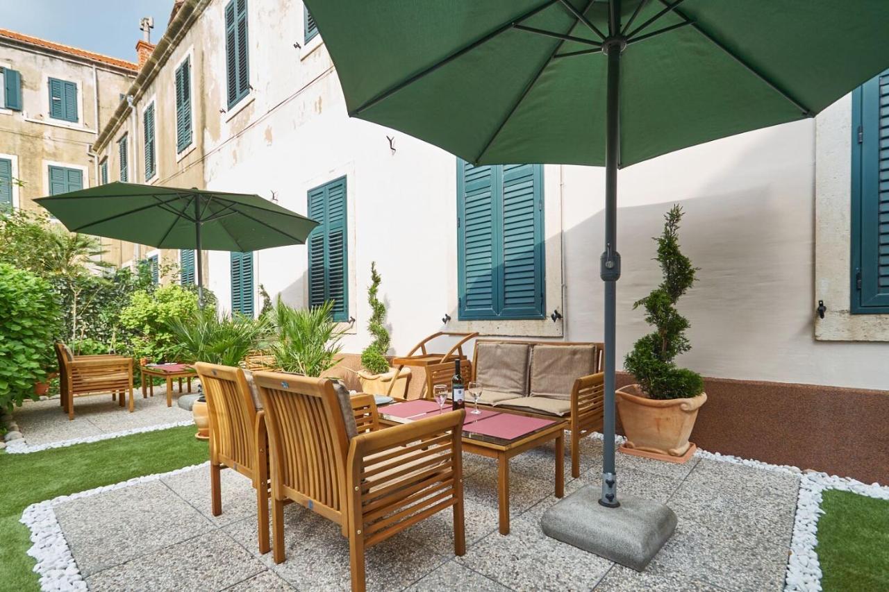 With Garden Next To Beach And Old Town